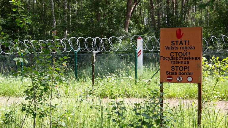 18 June 2024, Latvia, Karsava: "Stop - state border" is written in three languages on a sign on the Latvian border with Russia. Photo by: Alexander Welscher/picture-alliance/dpa/AP Images