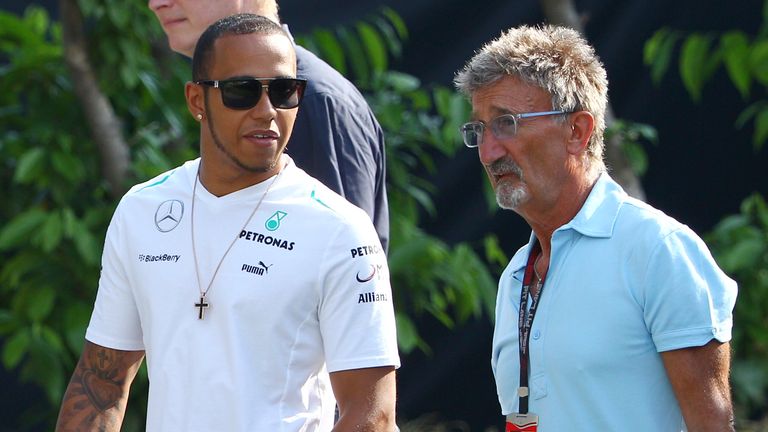 Lewis Hamilton walks with Eddie Jordan at the 2013 Singapore Grand Prix in 2013