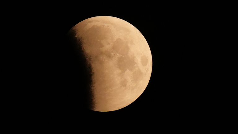 A lunar eclipse is visible above Reading, Berkshire, as the full moon passes into Earth's shadow. A lunar eclipse occurs when the Earth, sun, and moon are almost exactly in line and the moon is on the opposite side of the Earth from the sun. Picture date: Friday March 14, 2025. According to the Royal Astronomical Society, some people living in the west of the UK may see a total lunar eclipse with the naked eye - weather permitting. Others in the east and south east of England are only expected t