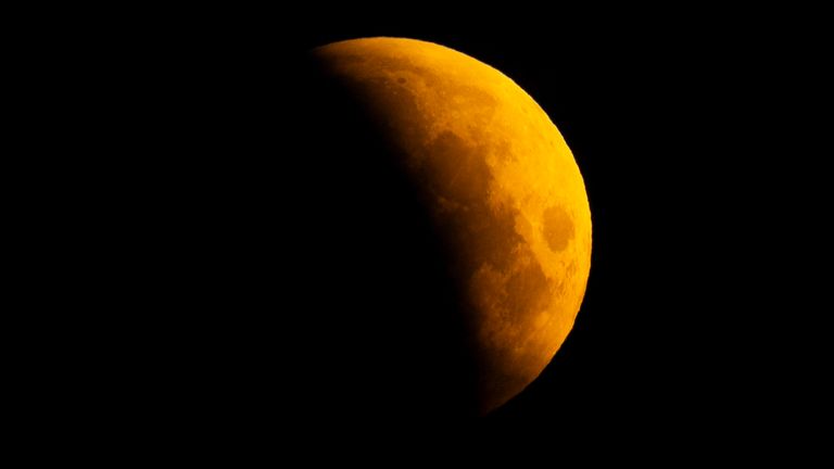 A lunar eclipse is visible above Surrey Quays in London as the full moon passes into Earth's shadow. Unlike in other parts of the world, except for some extreme western areas of the UK, the eclipse will be almost entirely partial. A lunar eclipse occurs when the Earth, sun, and moon are almost exactly in line and the moon is on the opposite side of the Earth from the sun. Picture date: Friday March 14, 2025.