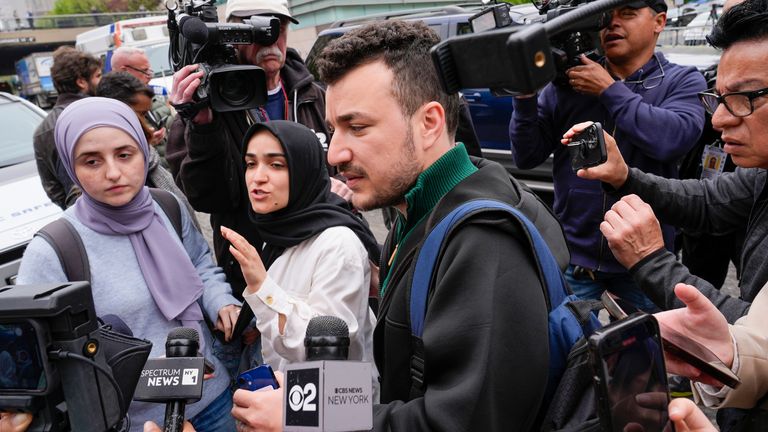 FILE - Members of the Columbia University Apartheid Divest group, including Sueda Polat, second from left, and Mahmoud Khalil, center, are surrounded by members of the media outside the Columbia University campus, Tuesday, April 30, 2024, in New York. (AP Photo/Mary Altaffer, File)