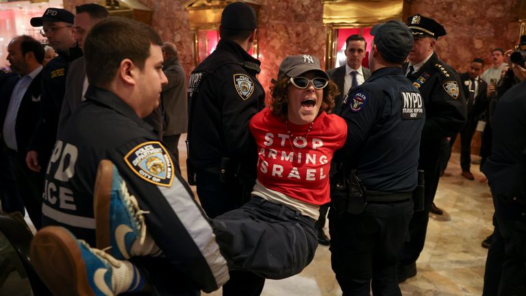 New York Police officers arrest a demonstrator from the group, Jewish Voice for Peace, who protested inside Trump Tower in support of Columbia graduate student Mahmoud Khalil, Thursday, March 13, 2025, in New York. (AP Photo/Yuki Iwamura)