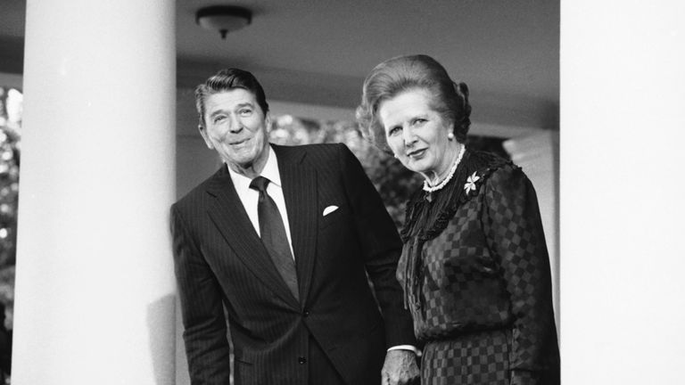 A man's world: Margaret Thatcher took training to lower her voice. Here she is alongside president Ronald Reagan in 1982. Pic: AP