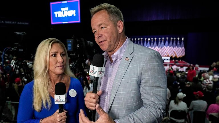 Right Side Broadcasting Network reporter Brian Glenn interviews Rep. Marjorie Taylor Greene, R-Ga., before Republican presidential candidate former President Donald Trump speaks in Rome, Ga., on Saturday, March 9, 2024. (AP Photo/Mike Stewart)