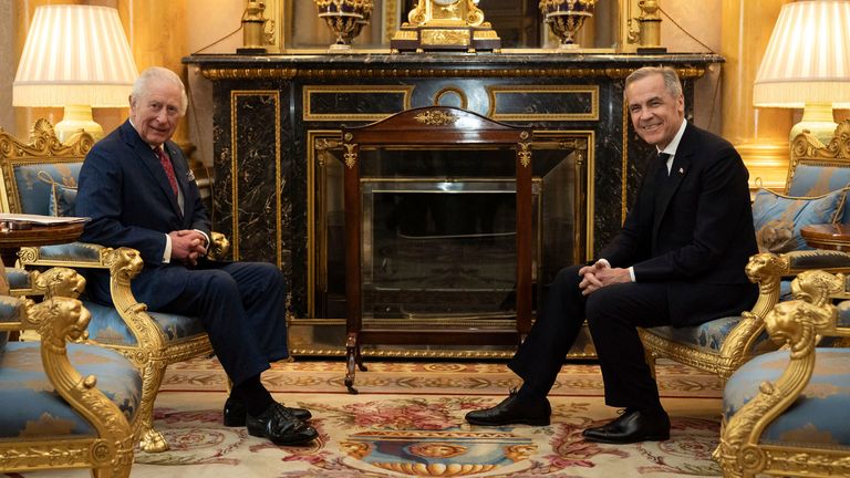 King Charles III, left, holds an audience at the Prime Minister of Canada, Mark Carney, right, in Buckingham Palace in London, England, Monday, March 17, 2025 (Aaron Chown/PA via AP, Pool)