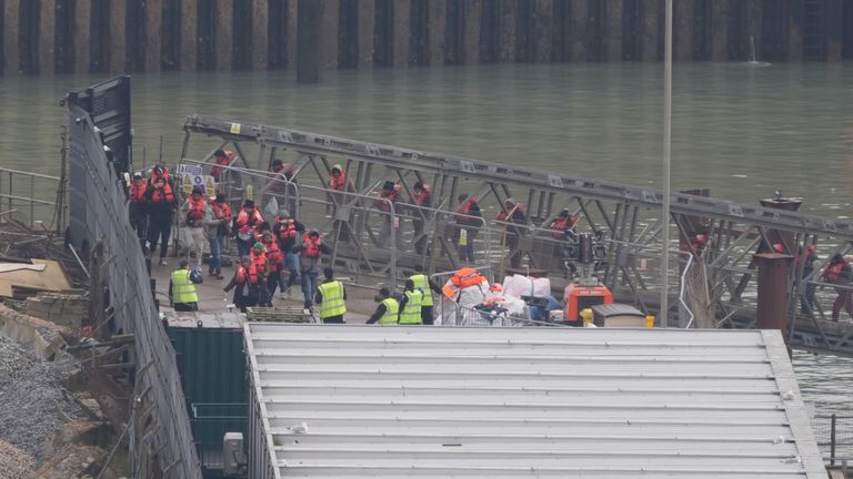 A group of people thought to be migrants at the Border Force compound in Dover after a small boat incident in the Channel. Pic: PA