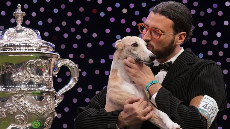 Miuccia, left, with her handler Giovanni Liguori. Pic: PA