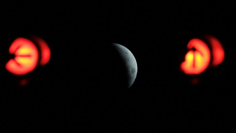 The moon is seen prior to the total lunar eclipse in Lisbon, Portugal, March 14, 2025. REUTERS/Pedro Nunes
