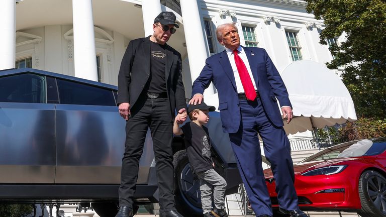 Musk and his son with the president. Pic: Reuters