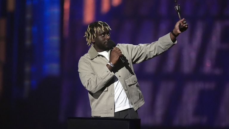 Myles Smith collects the rising star prize at the Brit Awards 2025. Pic: PA