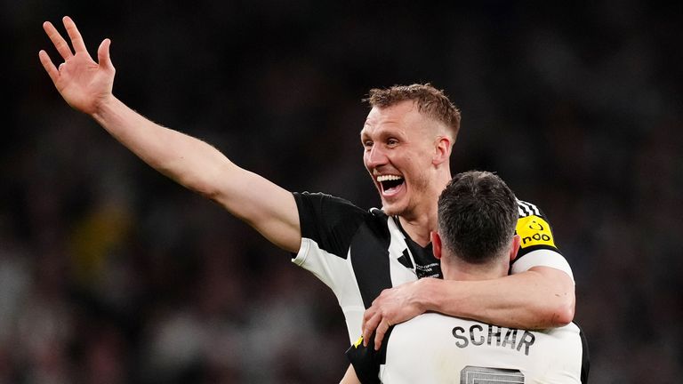 Dan Burn (left) and Fabian Schar celebrate winning the Carabao Cup. Pic: PA