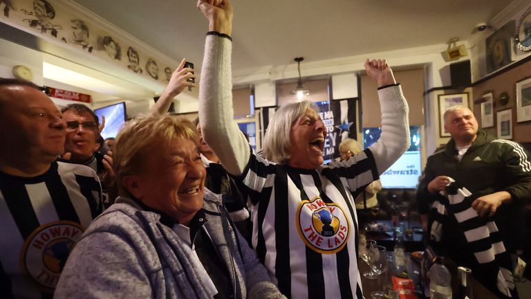 Fans celebrate in a pub in Newcastle. Pic: Reuters