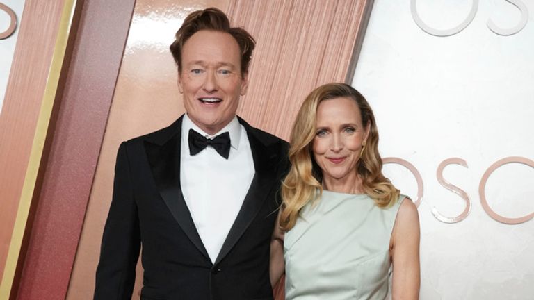 Conan O'Brien, left, and Liza Powel O'Brien arrive at the Oscars on Sunday, March 2, 2025, at the Dolby Theatre in Los Angeles. (Photo by Jordan Strauss/Invision/AP)