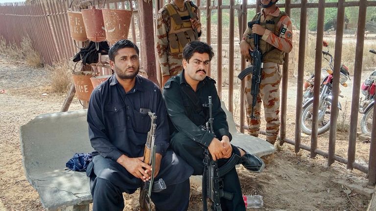 Paramilitary soldiers and police officers deploy at a railway station near the attack site of a passenger train by insurgents, in Mushkaf in Bolan district of Pakistan's southwestern Balochistan province, Wednesday, March 12, 2025. (AP Photo)