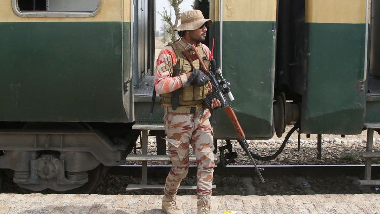 A soldier stands guard next to a rescue train after the hijack by separatist militants. Pic: Reuters