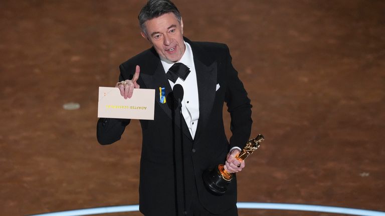 Peter Straughan accepts the award for best adapted screenplay for "Conclave" during the Oscars on Sunday, March 2, 2025, at the Dolby Theatre in Los Angeles. (AP Photo/Chris Pizzello)