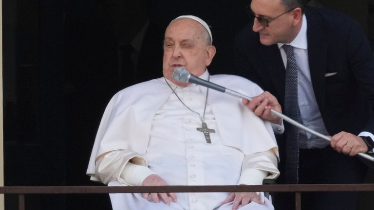 Pope Francis appears at a window of the Agostino Gemelli Polyclinic in Rome, Sunday, March 23, 2025, where he has been treated for bronchitis and bilateral pneumonia since Feb. 14. (AP Photo/Andrew Medichini)