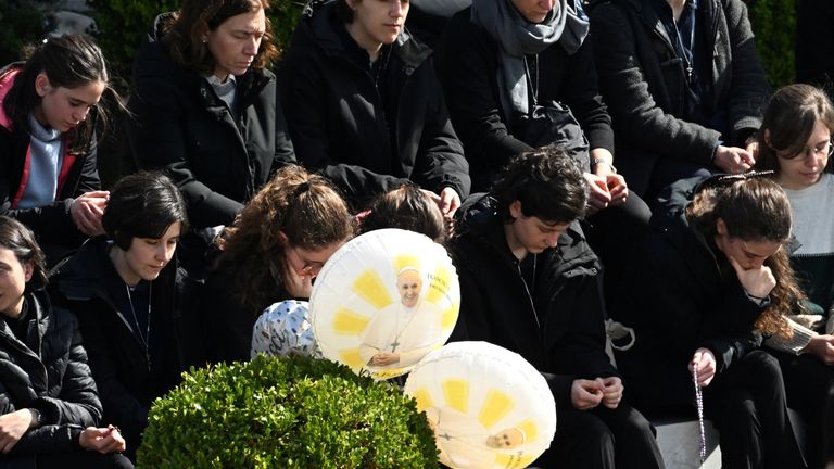 People pray for Pope Francis. Pic: Reuters