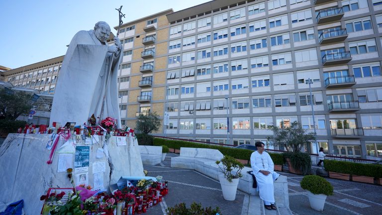 A man prays for Pope Francis in front of the Agostino Gemelli Polyclinic, in Rome, Thursday, March 6, 2025, where the Pontiff is hospitalized since Feb. 14. (AP Photo/Andrew Medichini)