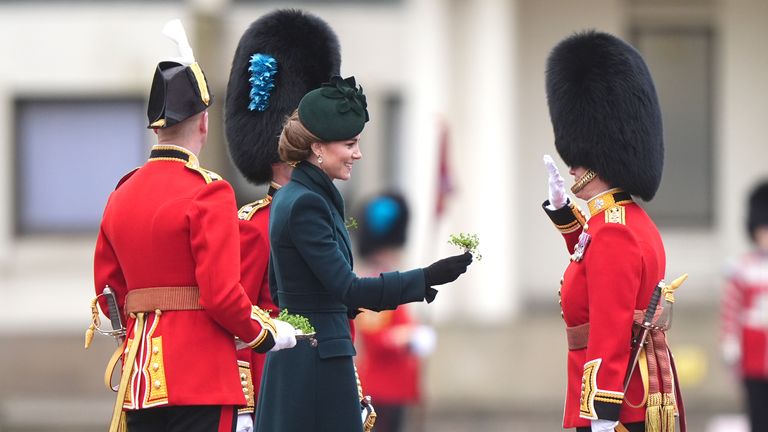 The Princess of Wales presents the traditional sprigs of shamrock to officers and guardsmen during her visit to the Irish Guards for their St Patrick's Day Parade at Wellington Barracks in London. Picture date: Monday March 17, 2025. PA Photo. See PA story ROYAL Kate. Photo credit should read: Aaron Chown/PA Wire