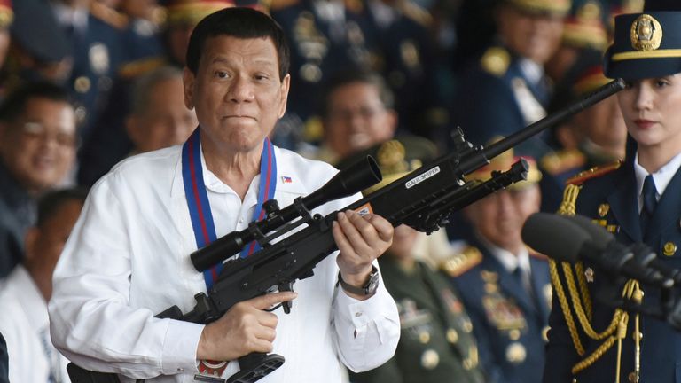 The former leader with a rifle in 2018. Pic: AP