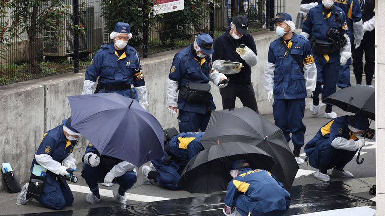 Police officers at the scene after the stabbing. Pic: AP