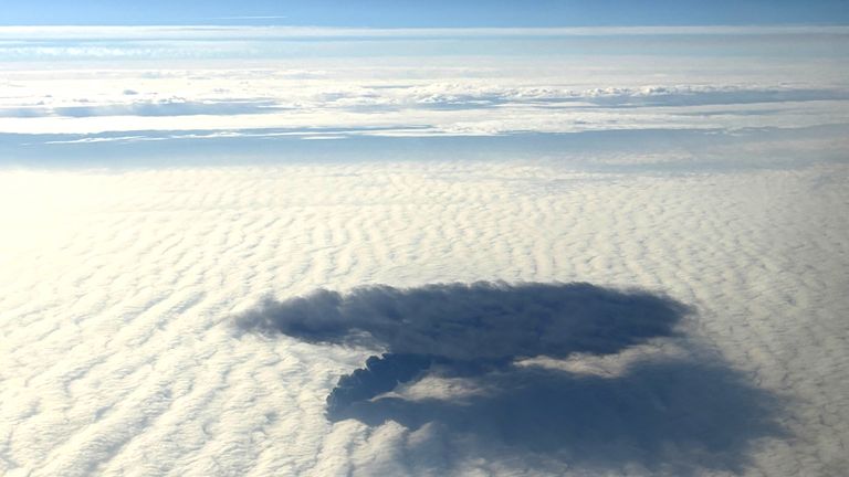 Plumes of smoke rise above clouds after Portuguese-flagged container ship, Solong, crashed into anchored Stena Immaculate, a tanker carrying U.S. military jet fuel, off Britain's east coast, as seen from mid-air, in this handout image obtained by Reuters on March 11, 2025. Paige Langley/Handout via REUTERS    THIS IMAGE HAS BEEN SUPPLIED BY A THIRD PARTY. NO RESALES. NO ARCHIVES.