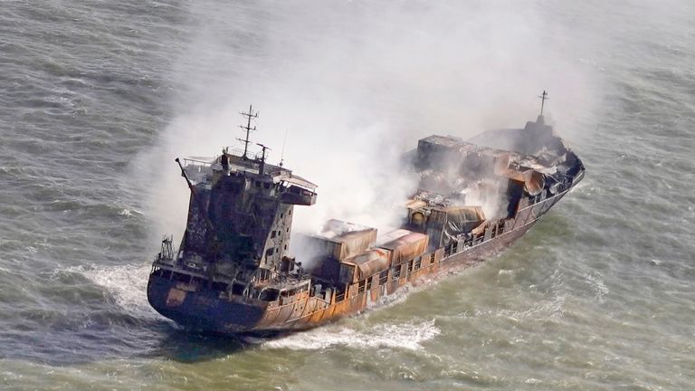 Tug boats shadow the Solong container ship as it drifts in the Humber Estuary, off the coast of East Yorkshire following a collision with the MV Stena Immaculate oil tanker, operating as part of the US government's Tanker Security Programme, on Monday. 