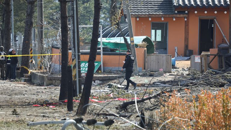 Debris strewn across a street in Pocheon. Pic: Reuters