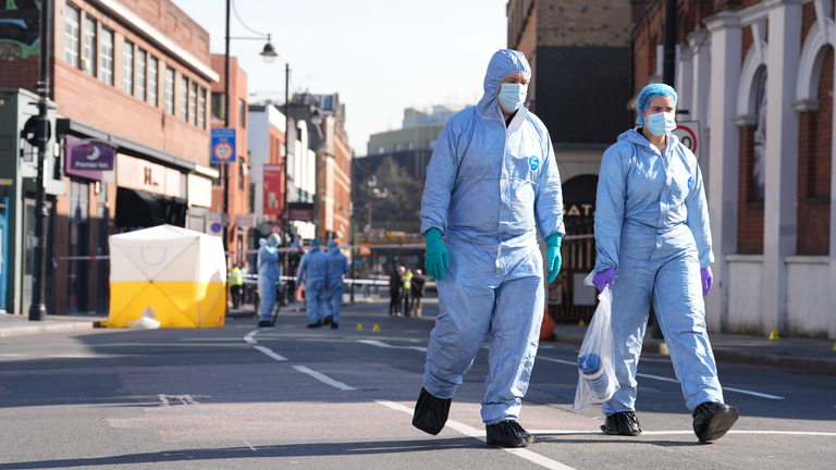 Forensic officers pictured on Thursday.  Pic: PA