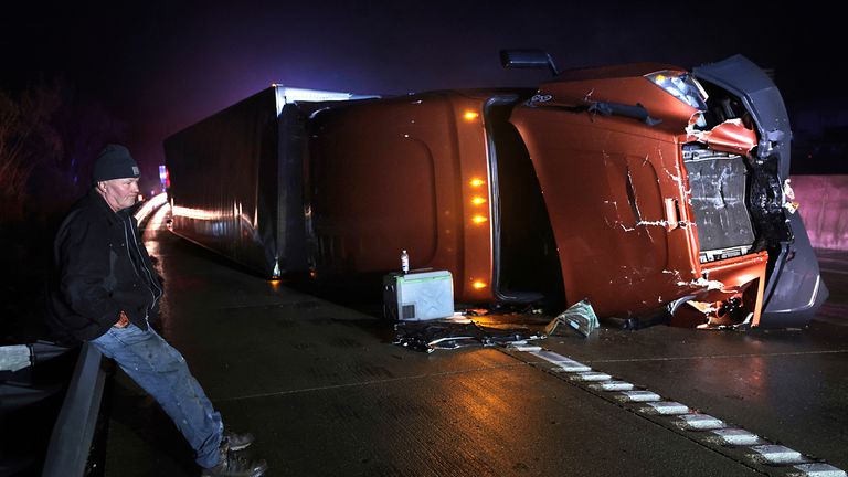 Lorries have been overturned. Pic: AP