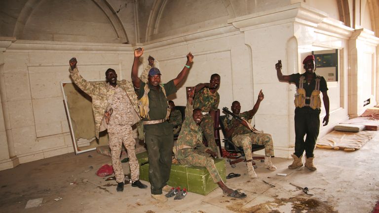 Sudan army soldiers celebrate after they took over the Republican Palace in Khartoum, Sudan, Friday, March 21, 2025. (AP Photo)