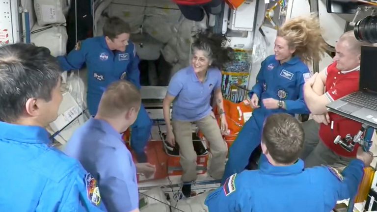 The moments after docking with Suni Williams, centre, finally facing the prospect of returning back to Earth. Pic: NASA/AP