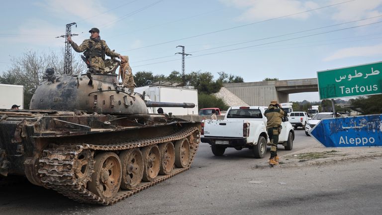 Reinforcement Syrian security forces deploy in the outskirts of Latakia, Syria, Friday, March 7, 2025. (AP Photo/Omar Albam)