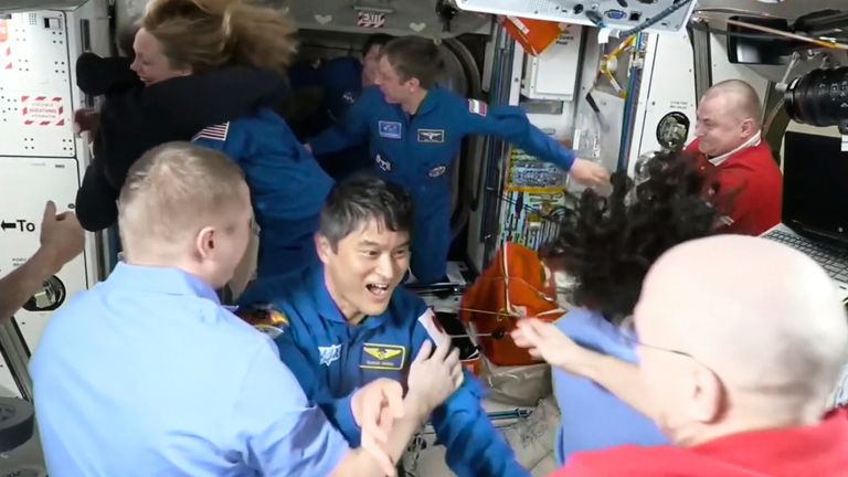 The Astronauts, including Japan's Takuya Onishi, greeting one another after arrival on the International Space Station.  Pic: NASA/AP