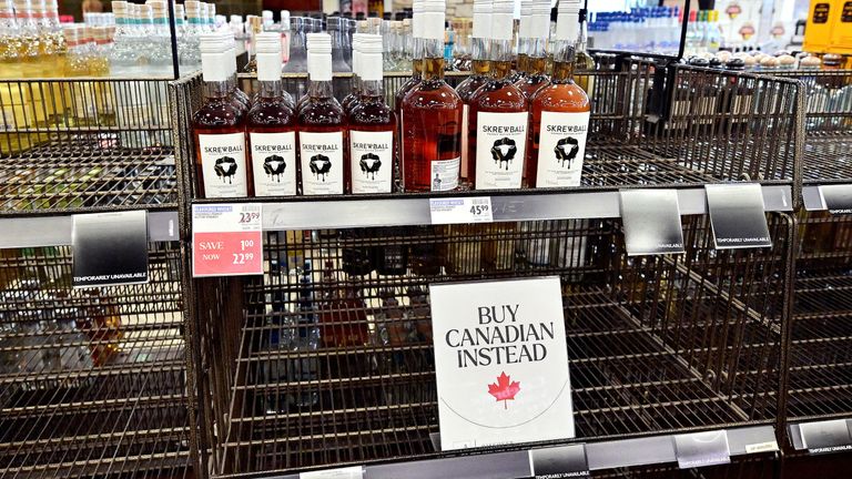 Empty shelves in the American Whiskey section of a shop in Vancouver. Pic: Reuters