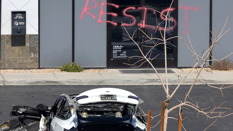 A burned Tesla vehicle is shown at a Tesla collision center Tuesday, March 18, 2025, in Las Vegas. (Steve Marcus/Las Vegas Sun via AP)