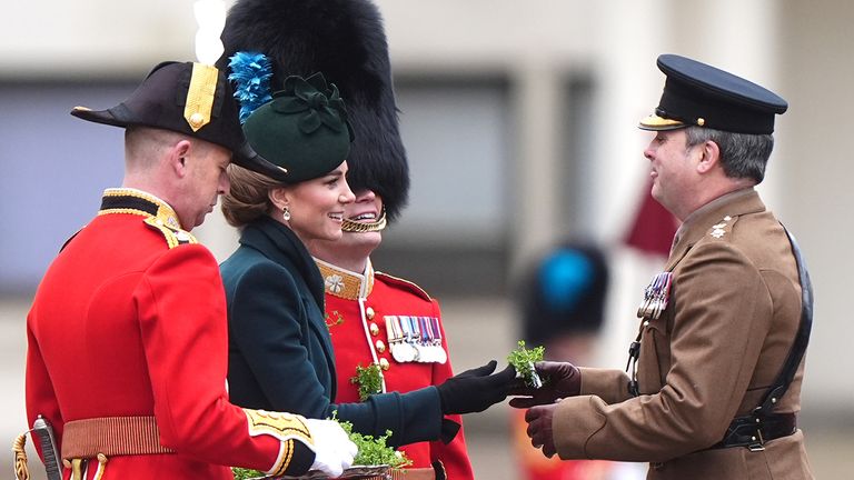 The Princess of Wales presents the traditional sprigs of shamrock to officers and guardsmen during her visit to the Irish Guards for their St Patrick's Day Parade at Wellington Barracks.
Pic: PA