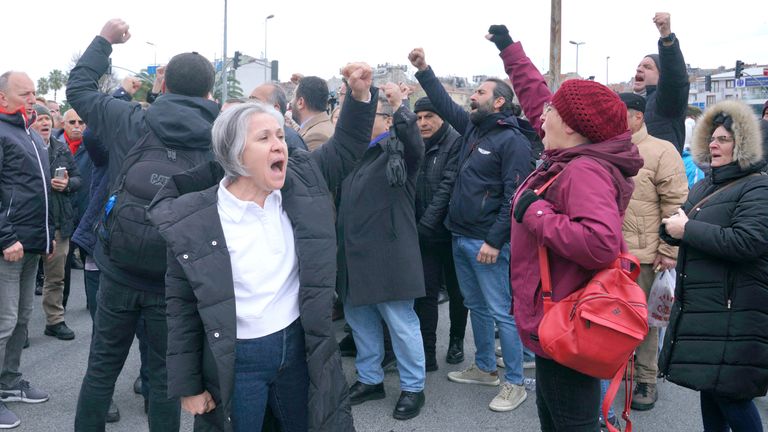 Supporters of Istanbul Mayor Ekrem Imamoglu shout slogans as they gather near the city's police headquarters in Istanbul, Turkey.
Pic: Reuters