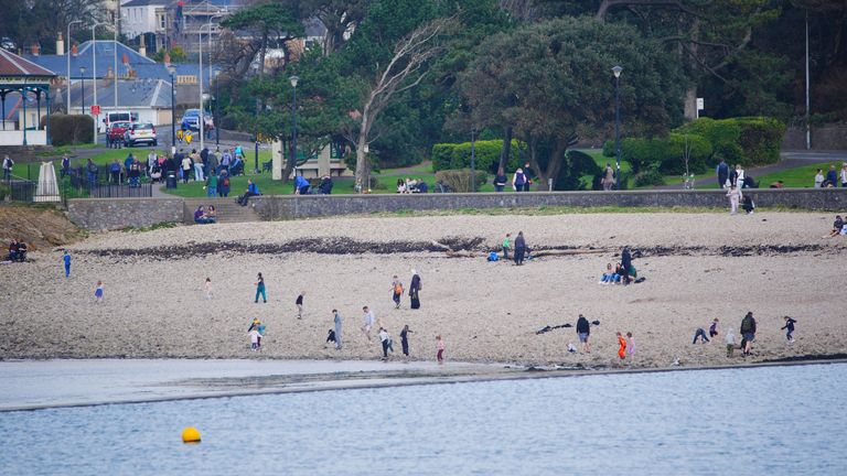 People enjoy the warm weather at Clevedon Marine Lake in Clevedon. Parts of the UK are expected to be warmer this weekend than holiday hotspots including the Balearic islands, Costa del Sol and the Amalfi Coast. Picture date: Saturday March 8, 2025. PA Photo. Photo credit should read: Ben Birchall/PA Wire