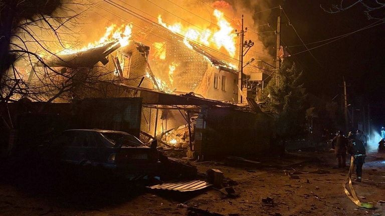 In this photo provided by the Ukrainian Emergency Service, firefighters try to put out a fire following a Russian attack in Zaporizhzhia, Ukraine, Friday, March 21, 2025. (Ukrainian Emergency Service via AP)