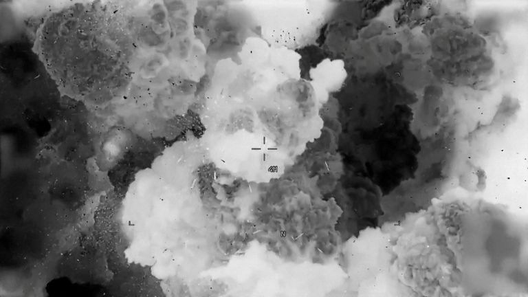 Smoke rises from an explosion after a projectile hit a group of buildings at an undisclosed location, after U.S. President Donald Trump launched military strikes against Yemen's Iran-aligned Houthis on Saturday over the group's attacks against Red Sea shipping, in this screengrab obtained from a handout video released on March 15, 2025. U.S. Central Command/Handout via REUTERS THIS IMAGE HAS BEEN SUPPLIED BY A THIRD PARTY