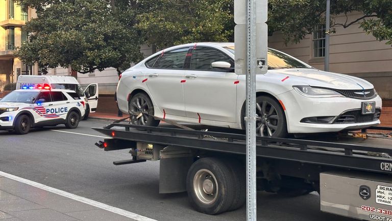 Armed man's car is being taken away by police