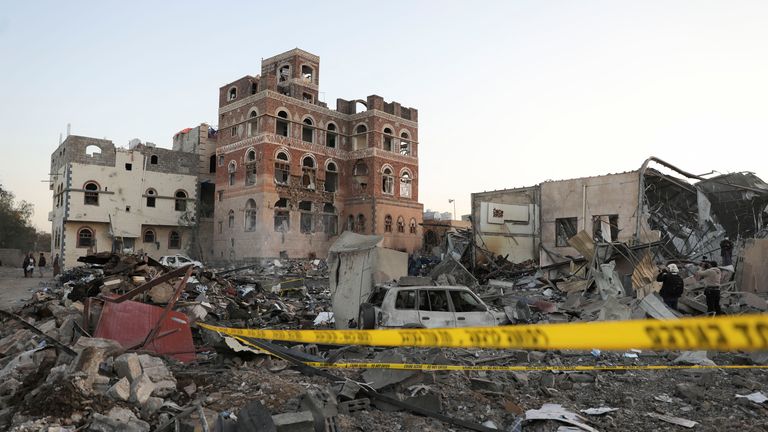 People gather at the site of U.S. strikes in Sanaa, Yemen,.
Pic: Reuters