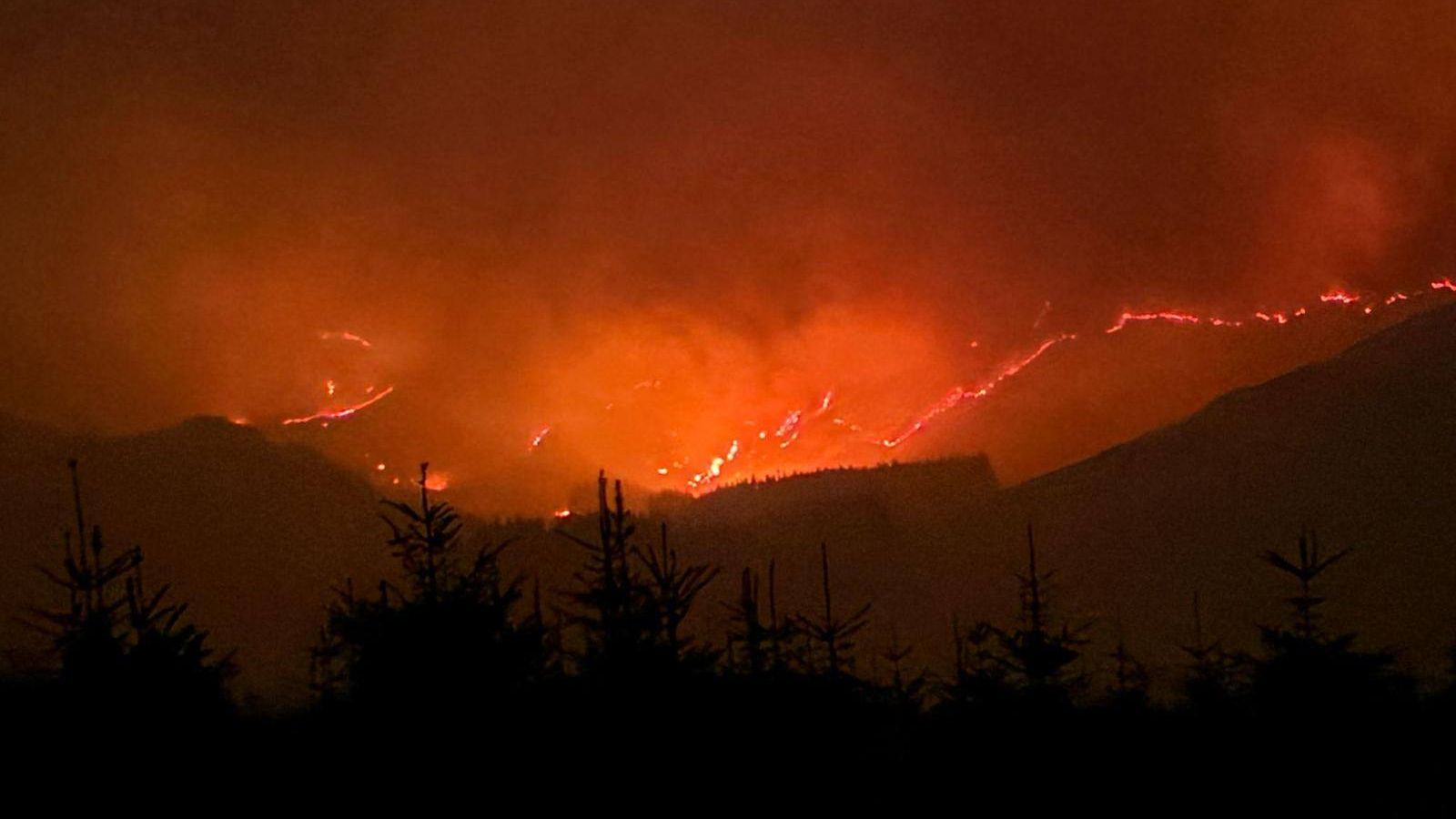 Helicopters water bombed the flames during the emergency response The Scottish government s