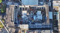 Rescue workers search for survivors at the Jet Set nightclub after its roof collapsed during a merengue concert in Santo Domingo, Dominican Republic, Tuesday, April 8, 2025.(Noticias SIN via AP)