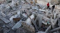 Palestinians inspect the site of an Israeli strike on a house, in Khan Younis in the southern Gaza Strip April 2, 2025. REUTERS/Hatem Khaled TPX IMAGES OF THE DAY
