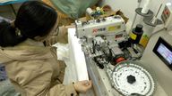 A small factory in Guangzhou which specialises in adding buttons to garments