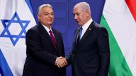 Hungarian Prime Minister Viktor Orban and Israeli Prime Minister Benjamin Netanyahu shake hands, in Budapest, Hungary.
Pic: Reuters
