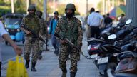 Indian paramilitary soldiers patrol as they guard at a busy market in Srinagar, Indian controlled Kashmir, Tuesday, April 29, 2025. (AP Photo/Mukhtar Khan)